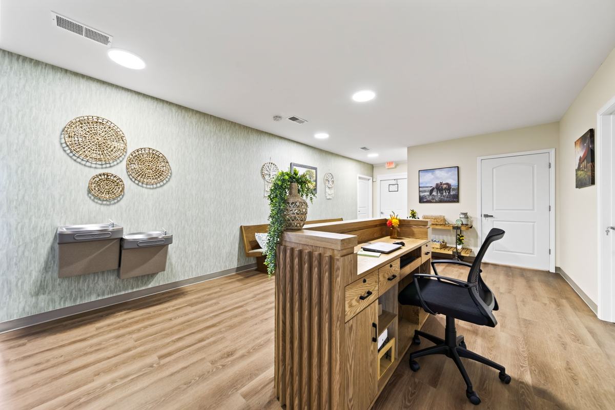 Staff desk with an office chair and water station, on hand around the clock